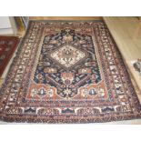 A Caucasian blue ground rug, 212 x 150cm