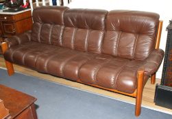 A mid century Danish Ekornes teak and leather Amigo three seater sofa, W.210cm D.88cm H.88cm