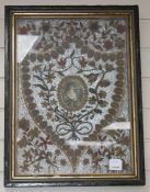 An early 19th century paper scroll work panel, formed with a printed miniature within a floral
