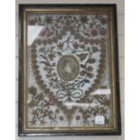 An early 19th century paper scroll work panel, formed with a printed miniature within a floral