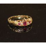A George V 18ct gold, three stone ruby and two stone diamond set half hoop ring, size P, gross