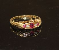 A George V 18ct gold, three stone ruby and two stone diamond set half hoop ring, size P, gross