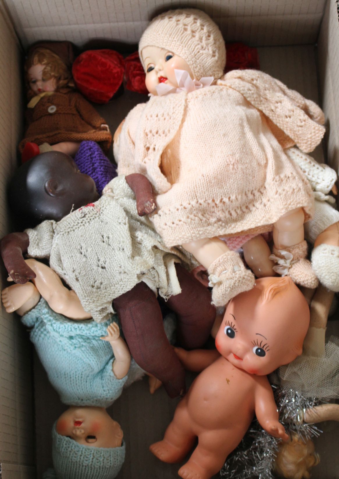 Ten plastic and composition dolls including Xmas fairy