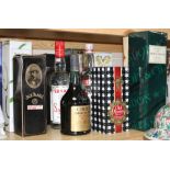 A group of assorted wines and spirits, comprising: - Harveys' Bristol Cream, boxed- Mouton Cadet
