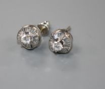 A pair of modern 18ct white gold and diamond cluster earstuds, with central raised claw set round