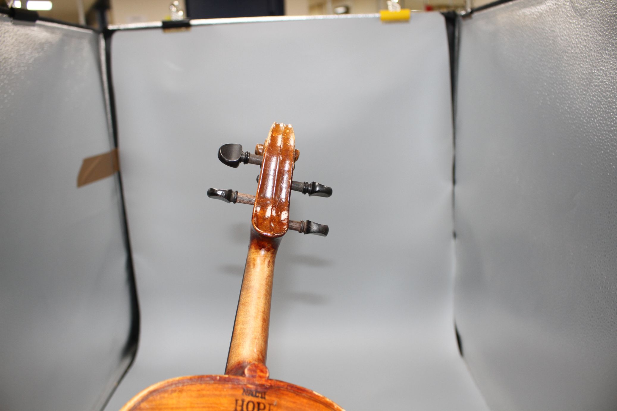A violin with two piece back and bow, and a child's violin with bow, both with cases Condition:- - Image 43 of 44