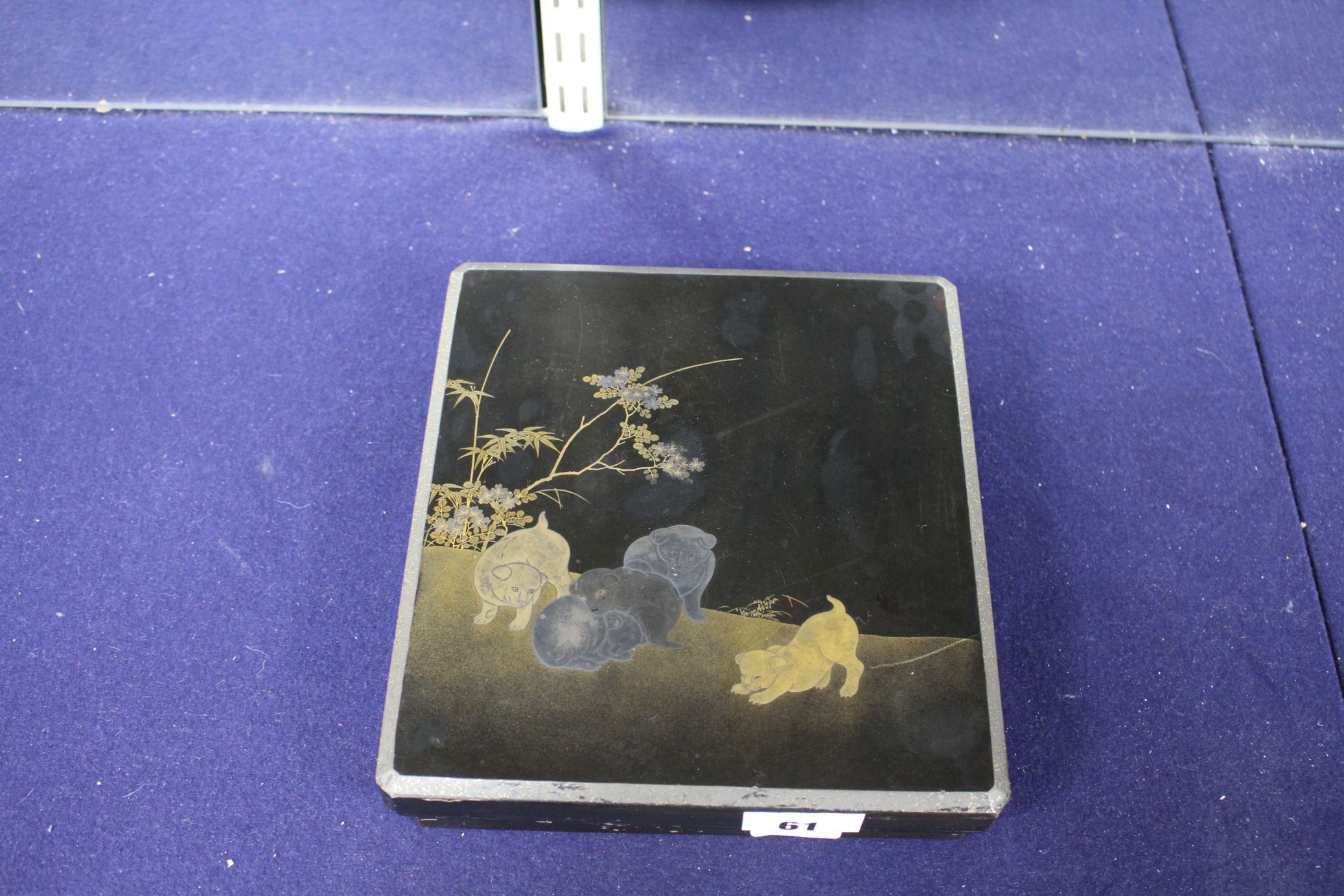 A Japanese Meiji lacquer writing box, the lid decorated with five puppies playing in a garden, - Image 2 of 5