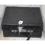 An early 20th century black crocodile toilet case, 40 x 33 x 18cm Condition: Handle detached,