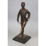 A bronze figure of a late 19th century Military officer, on ebonised plinth, height 38cm