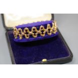 A late Victorian 9ct expanding bracelet, in original fitted box, weight 12.3 grams. Condition: