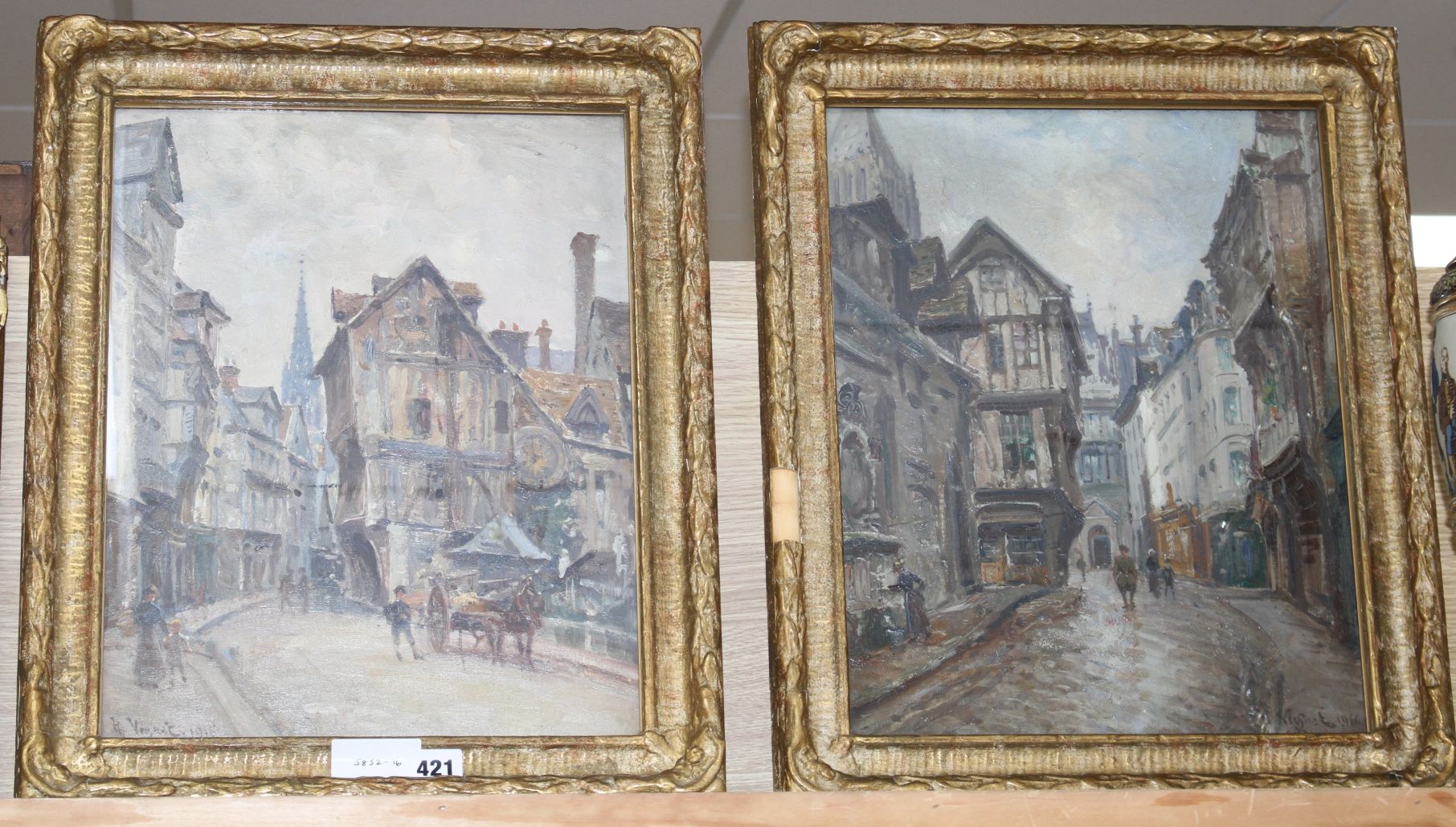 Henri Vognet (1857-1920), pair of oils on board, French street scenes, signed and dated 1916, 39 x