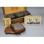 A collection of Magic Lantern slides, mostly text, a group of stereographic cards and three camera