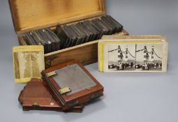 A collection of Magic Lantern slides, mostly text, a group of stereographic cards and three camera