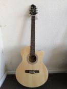 A Woodstock electro acoustic guitar Condition: Electrics not fully working, some chips and scratches