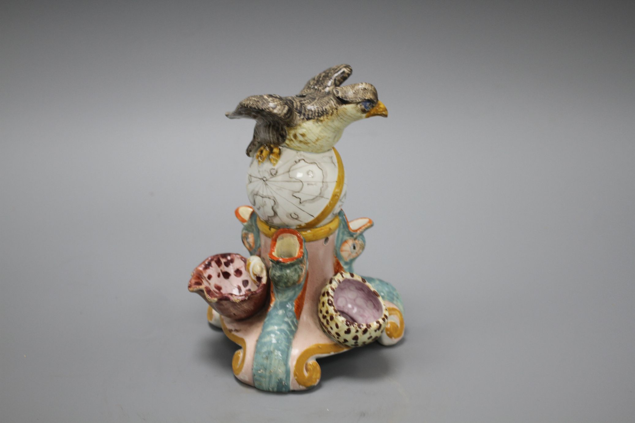 An early 19th century Staffordshire inkwell, modelled with an eagle perched upon a globe above three - Image 2 of 6