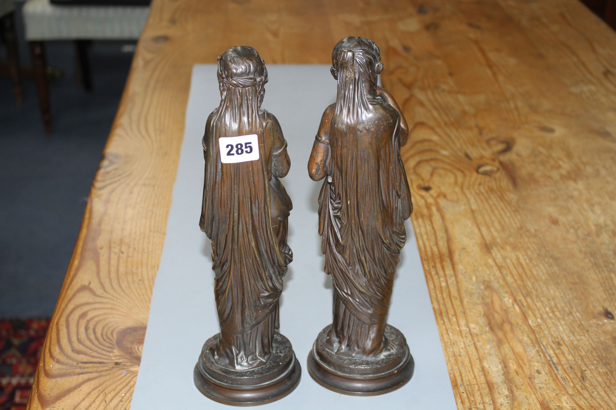 A pair of late 19th century French bronze figures of muses, each standing holding flowers, height - Image 2 of 2