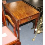 A George III strung mahogany butterfly wing mahogany table, with frieze drawers and squared