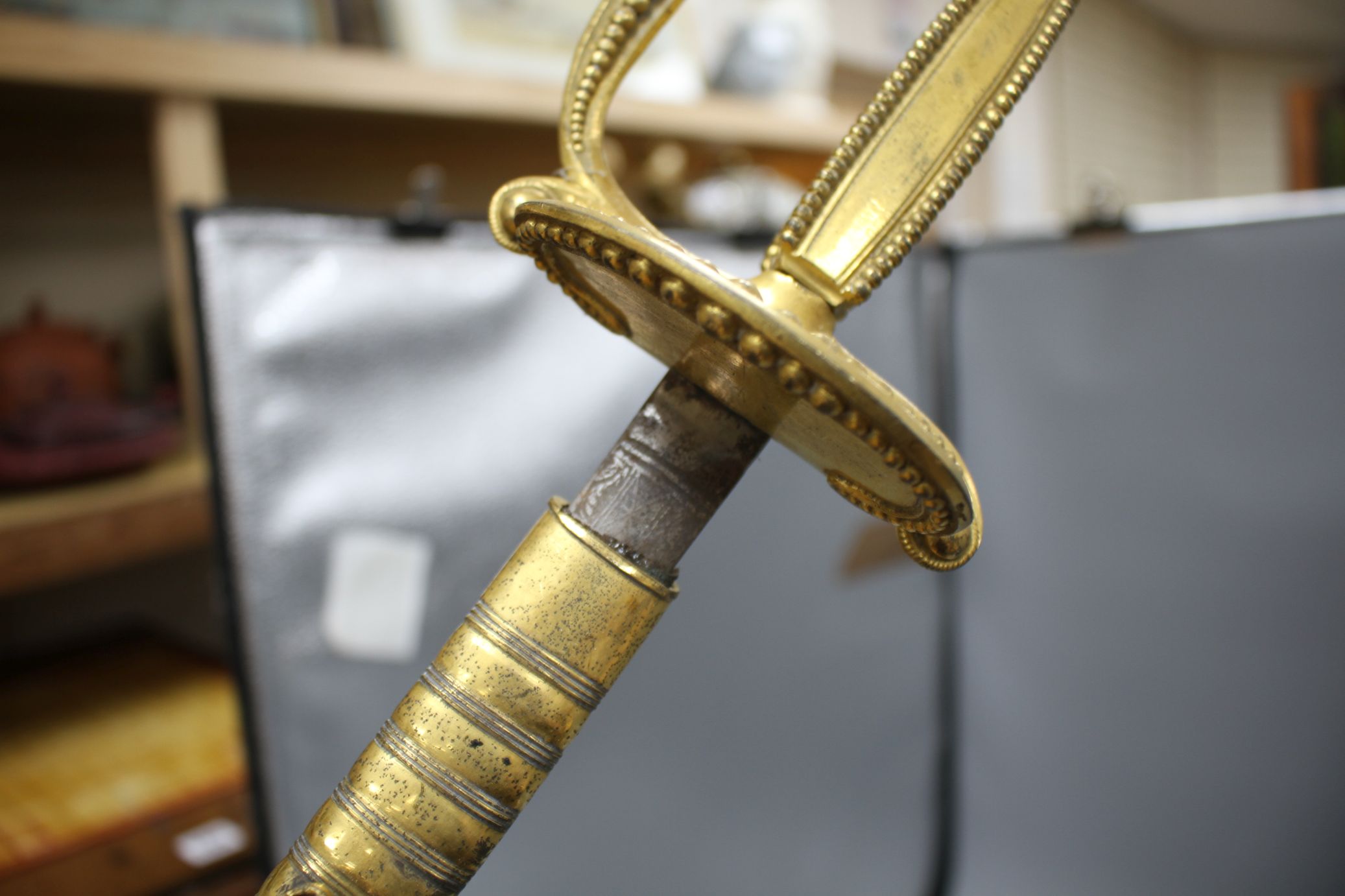 A cut steel dress sword by Ede & Ravenscroft of London and two brass hilted dress swords Condition:- - Image 23 of 30