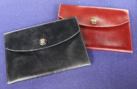 Two Hermes leather clutch purses, one in black, the other burgundy, 24 x 16.5cm, with one Hermes