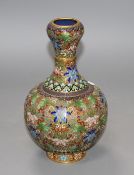 A Chinese champleve enamelled gilt brass vase, decorated with flowers, height 23cm Condition: One or