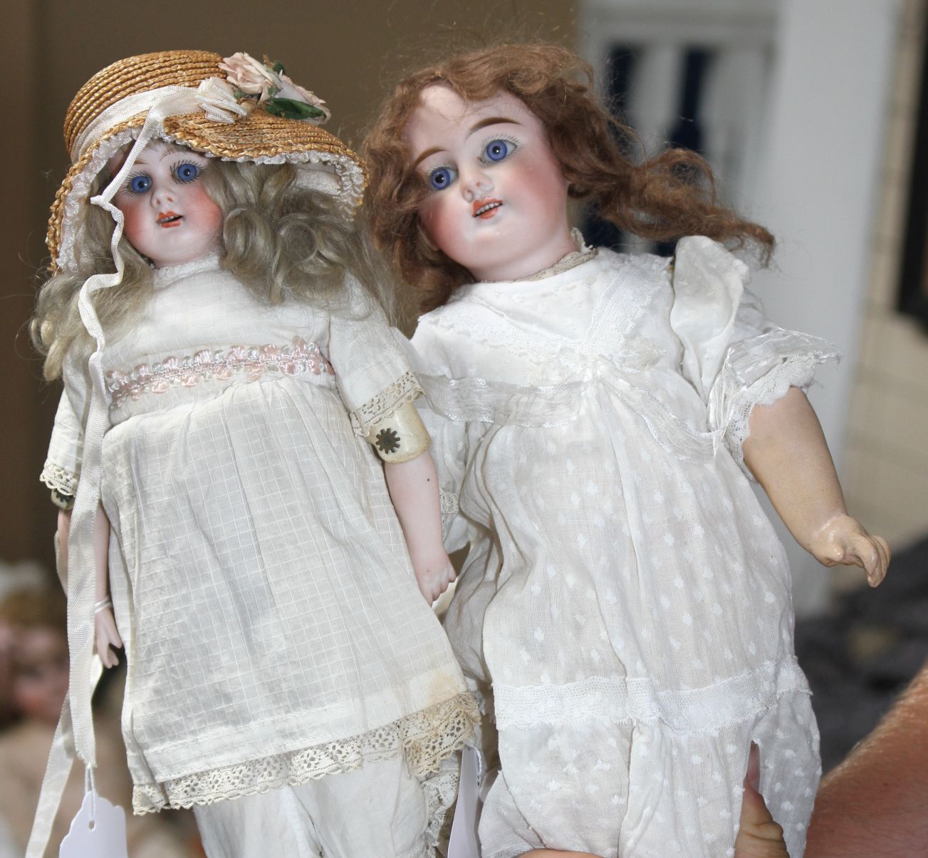 A German doll marked 62, original wig, fixed eyes and wrists, 14in., and a German doll marked 3002