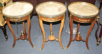 A near set of three Meuble Francais marble topped occasional tables, Diam.40cm H.67cm Condition: