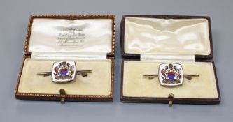 A modern pair of silver gilt and enamel brooches, decorated with ornate crest, 42mm, gross weight