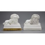 Two Staffordshire porcelain figures of recumbent poodles, c.1830-50, possibly Lloyd Shelton, the
