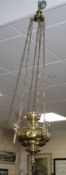 An Edwardian brass hanging oil lamp, drop 104cm Condition: A little oxidised where the lacquering