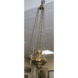 An Edwardian brass hanging oil lamp, drop 104cm Condition: A little oxidised where the lacquering