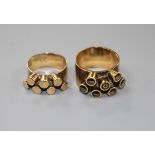 Two 1960's modernist 9ct gold dress rings, both decorated with raised cylindrical motifs, maker