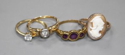 Four assorted 9ct and gem set rings. Condition: 9ct gold and collet set solitaire diamond ring, size