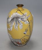 A Japanese Meiji period cloisonne vase, decorated with a crab and fading foliage against a beige