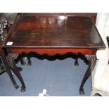 A George II style mahogany silver table, with dished rectangular top and acanthus carved cabriole