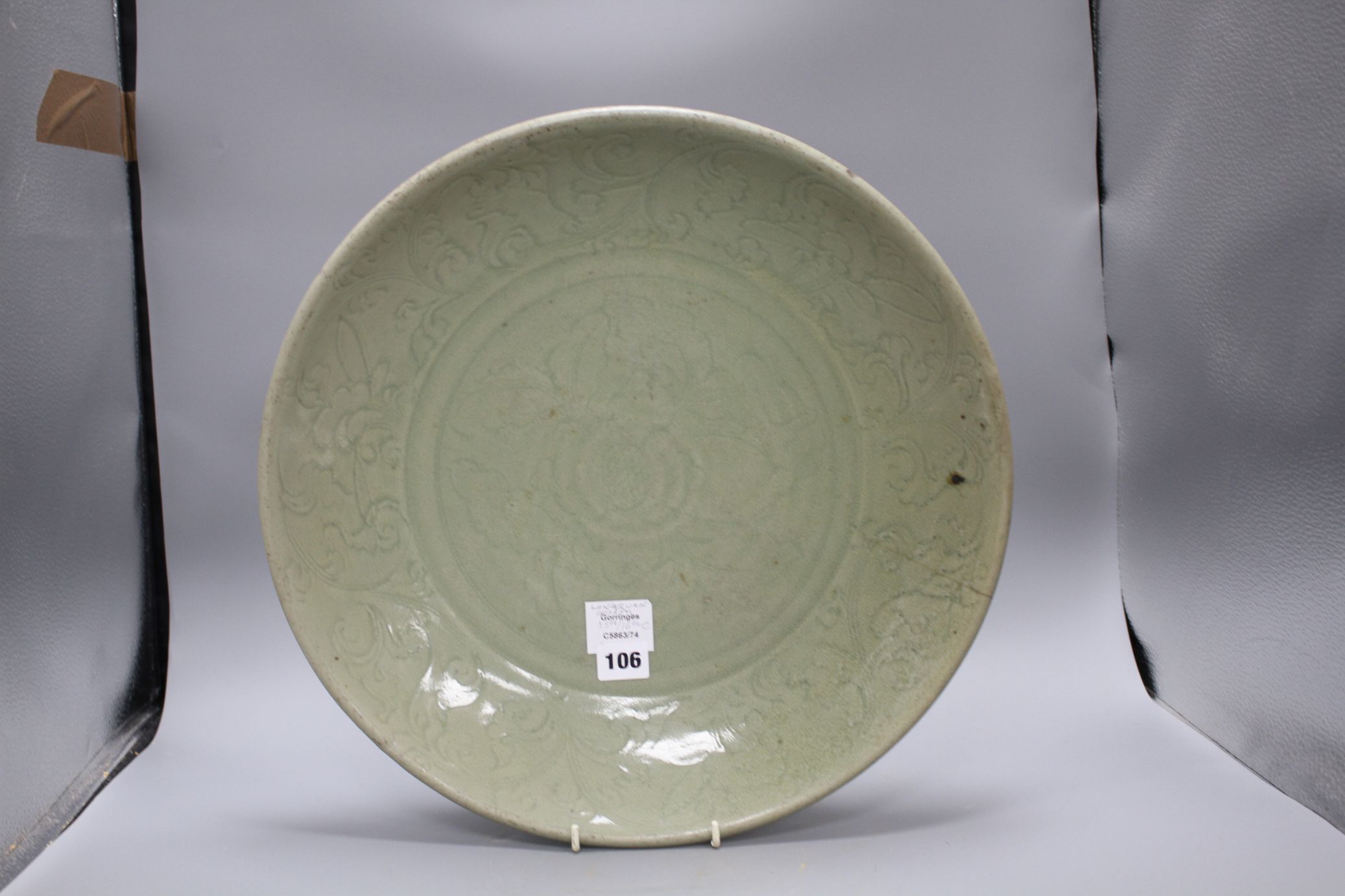 A 15th / 16th century Longquan celadon dish, incised with flowers, diameter 43cm, height 8.5cm - Image 8 of 12