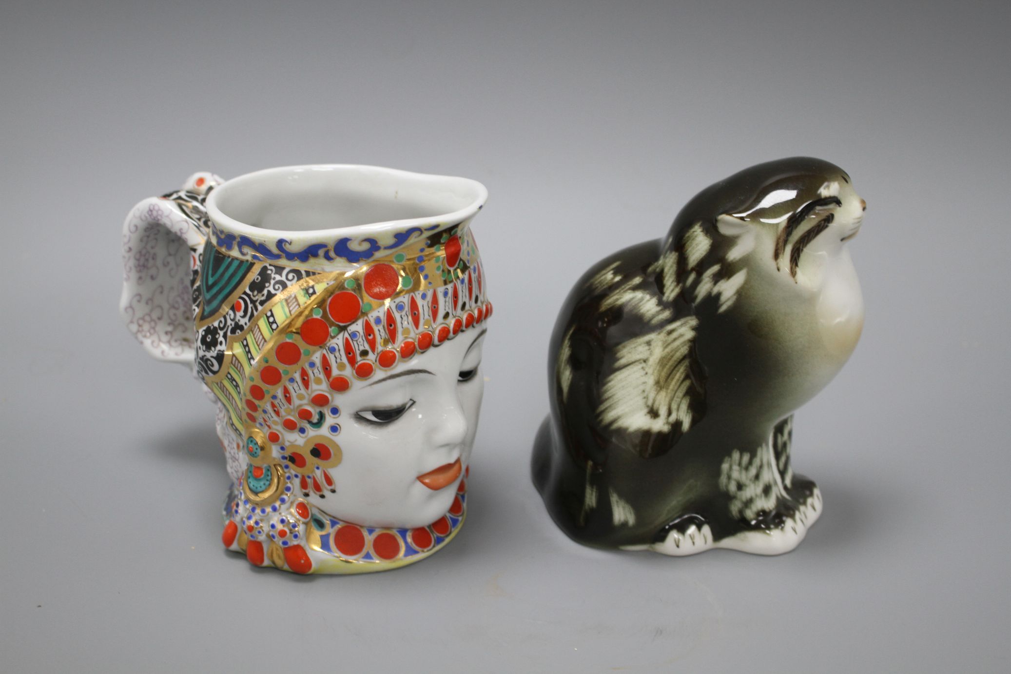A Russian ceramic figure of a seated cat, height 15cm, and a character jug depicting a woman's - Image 2 of 4