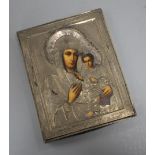 A Russian white metal overlaid tempera on panel icon, depicting the Virgin Mary and Christ child, 22