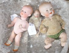 A Heubach character doll, intaglio eyes, 8in., a German all bisque baby, 4in. and a German character