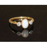A mid 20th century 18ct and Pt, white opal and diamond three stone ring, size O/P, gross weight 2.