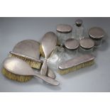 A George V eleven piece silver mounted dressing table set, by Asprey & Co, London, 1928, mirror 27.