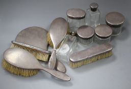 A George V eleven piece silver mounted dressing table set, by Asprey & Co, London, 1928, mirror 27.