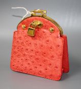 An Asprey red ostrich skin clutch purse, with gilt metal mount and padlock clasp, width 11cm