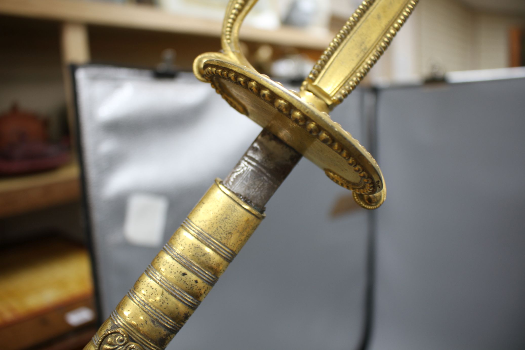 A cut steel dress sword by Ede & Ravenscroft of London and two brass hilted dress swords Condition:- - Image 9 of 30