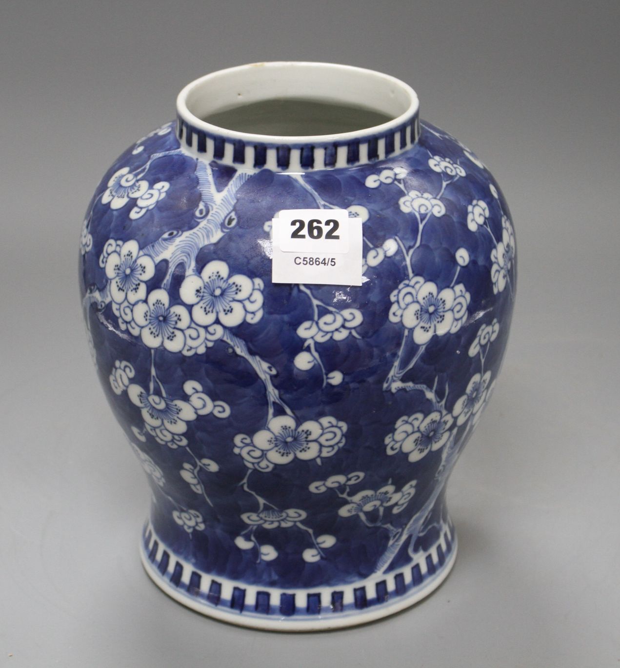 A Chinese blue and white prunus pattern baluster vase, height 25cm Condition: One small chip glued