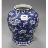 A Chinese blue and white prunus pattern baluster vase, height 25cm Condition: One small chip glued