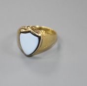 A Victorian yellow metal (probably 18ct) and shield shaped sardonyx 'poison' ring, size L/M, gross