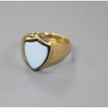 A Victorian yellow metal (probably 18ct) and shield shaped sardonyx 'poison' ring, size L/M, gross