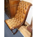 A Regency style library chair with buttoned leather upholstery, W.54cm D.84cm H.100cm Condition: Tan