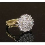 A modern 18ct gold and diamond cluster ring, size M, gross weight 7.8 grams. Condition: Some minor