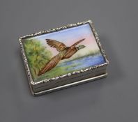 A modern silver and enamel snuff box, decorated with a pheasant in flight, Birmingham, 1982, 47mm.